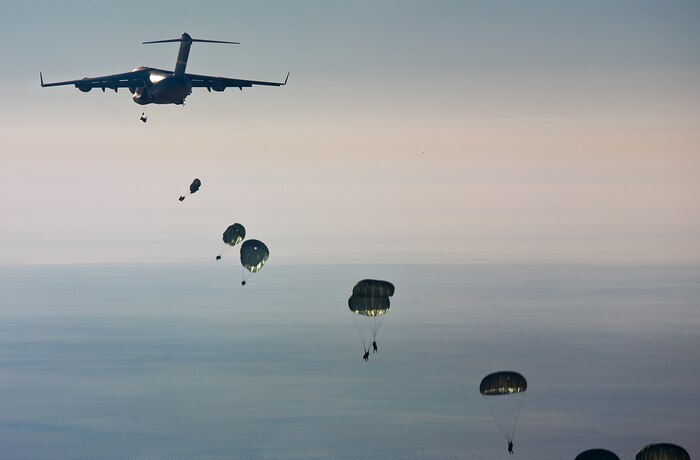 U.S., Egyptian, Pakistani, Kuwaiti and German soldier jump out of a C-17 onto a drop zone west of Cairo, Egypt following a non-stop, 15-hour flight from Pope AFB, N.C., as part of Bright Star Exercise Oct. 12. (U.S. Air Force photo/Col. Joseph Mancy)