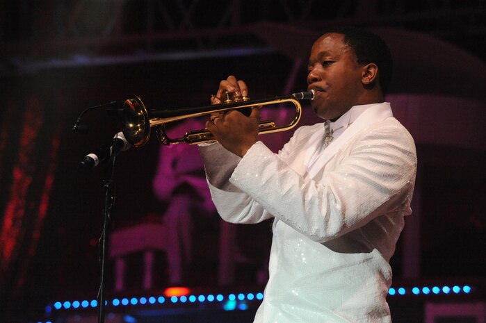 Senior Airman Anthoney Williams plays the trumpet during the Tops in Blue "To Dream" show at the North Charleston Performing Arts Center in North Charleston Nov. 8. Tops in Blue serves as an expeditionary entertainment unit to provide quality entertainment from within Air Force resources for the Air Force family, with priority to Air Force members stationed worldwide at remote and deployed locations. Airman Williams is a performer with Tops in Blue. (U.S. Air Force photo/Staff Sgt. Marie Brown)