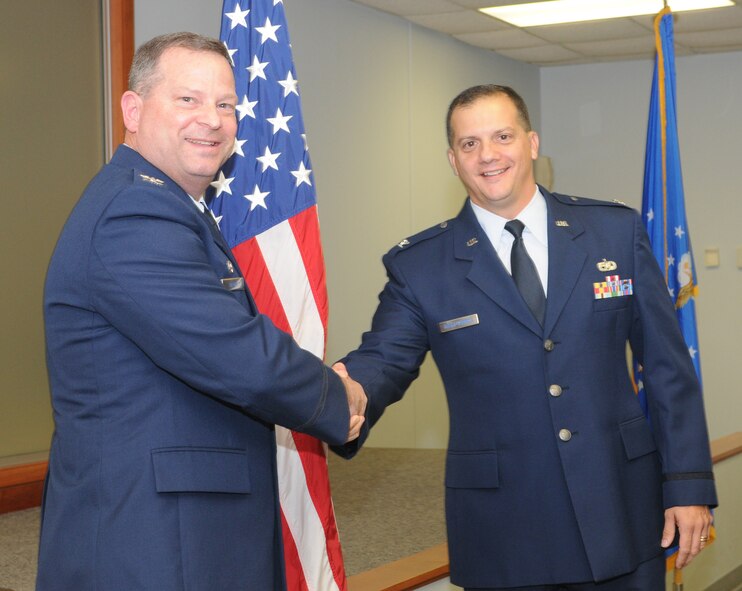 Col. Alan Lerner (left), 512th Maintenance Group commander, congratulates Col. Nicholas Koski-Vacirca during a promotion ceremony, Dec. 8, here. Colonel Koski-Vacirca was recently promoted to the rank of colonel. The former 512th MXG deputy commander will be taking a Reserve position with the Federal Emergency Management Agency in Washington D.C. (U.S. Air Force photo/Staff Sgt. Steve Lewis)  