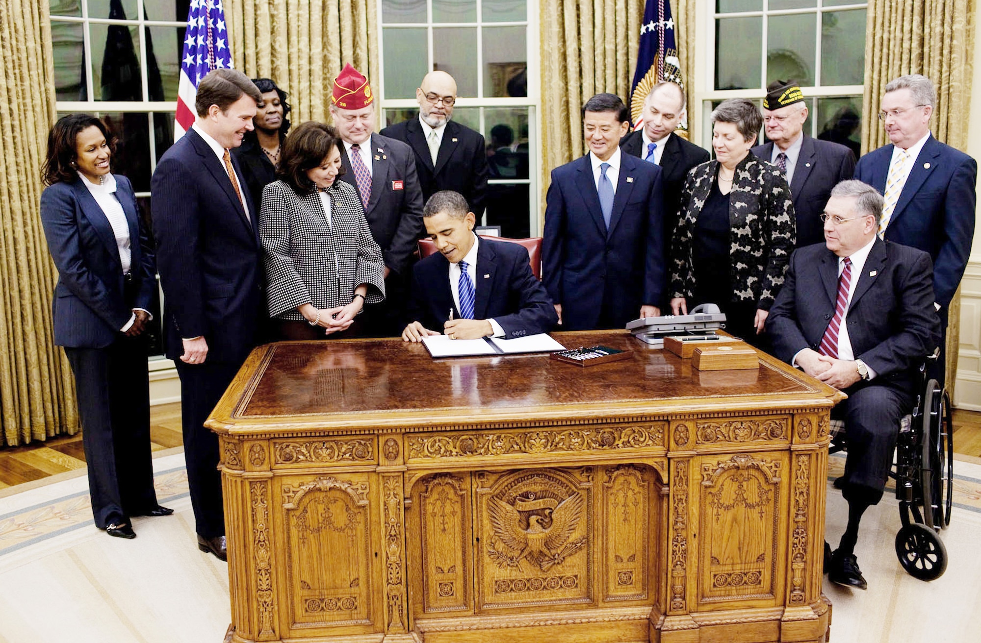 President Barack Obama signs an executive order on the employment of veterans in the federal government Nov. 9, 2009 in the Oval Office. (White House photo/Pete Souza)