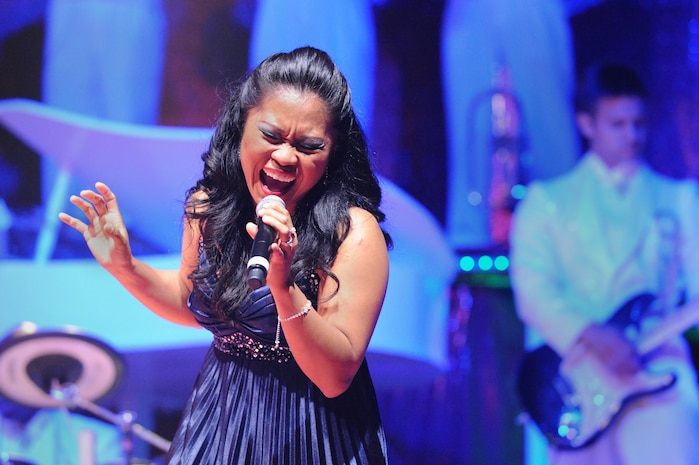 Senior Airman Cristy Henderson sings during the Tops in Blue "To Dream" show at the North Charleston Performing Arts Center in North Charleston Nov. 8. Tops in Blue promotes community relations, supports recruiting efforts and its members serve as ambassadors for the U.S. and the Air Force. Airman Henderson is a vocalist with Tops in Blue. (U.S. Air Force photo/Staff Sgt. Marie Brown)