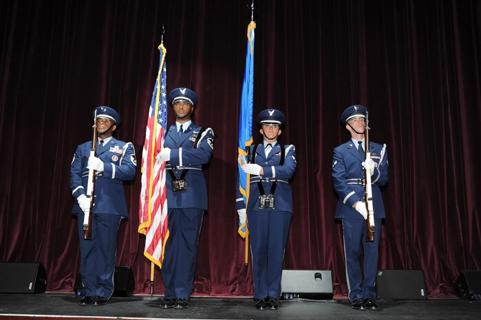 Members of the 437th Airlift Wing and 315th Airlift Wing honor guard present the colors prior to the start of the Tops in Blue performance at the North Charleston Performing Arts Center in North Charleston Nov. 8. Tops in Blue represents the Air Force as one of the oldest and most widely renowned productions, made up of talented amateur performers selected for their entertainment abilities. (U.S. Air Force photo/Staff Sgt. Marie Brown)