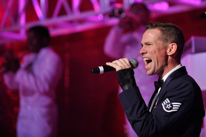 Staff Sgt. Timothy Womble sings during the Tops in Blue "To Dream" show at the North Charleston Performing Arts Center in North Charleston Nov. 8. Each year, Air Force personnel compete in base talent contests and the most talented move on to higher levels of competition, which results in an elite group of the most talented competitors for Tops in Blue. Sergeant Womble is a vocalist with Tops in Blue. (U.S. Air Force photo/James Bowman)