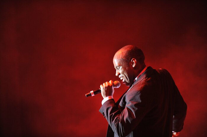 Senior Airman Demetrius Johnson sings during the Tops in Blue "To Dream" show at the North Charleston Performing Arts Center in North Charleston Nov. 8. The mission of Tops and Blue is to perform for military members and their families throughout the world. Airman Johnson is a vocalist with Tops in Blue. (U.S. Air Force photo/James Bowman)