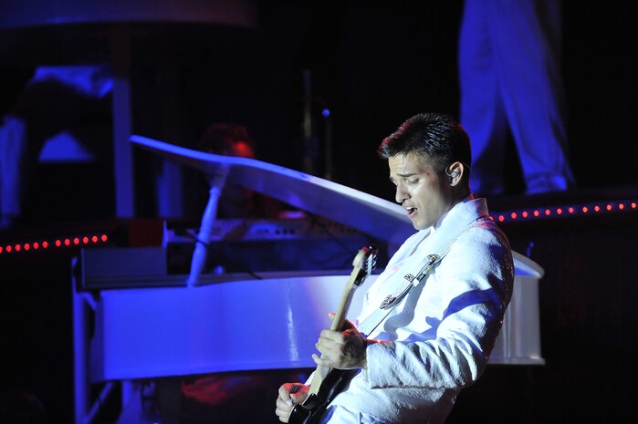 Airman 1st Class Shane Jones plays his guitar during the Tops in Blue "To Dream" show at the North Charleston Performing Arts Center  in North Charleston Nov. 8. Each year, Air Force personnel compete in base talent contests and the most talented move on to higher levels of competition, which results in an elite group of the most talented competitors for Tops in Blue. Airman Jones is a guitarist with Tops in Blue. (U.S. Air Force photo/James Bowman)