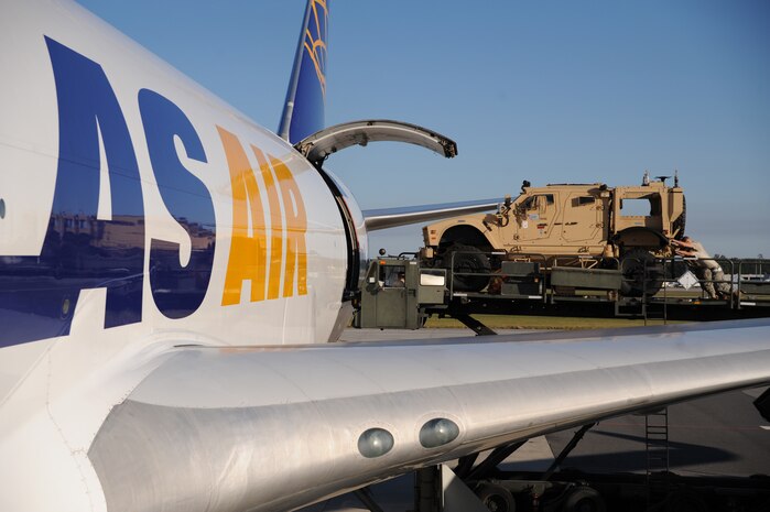 A mine-resistant, ambush-protected all-terrain vehicle is loaded onto a Boeing 747-400 aircraft here Nov. 7. Airmen with the 437th Aerial Port Squadron loaded each M-ATV through the side of the aircraft with two inches of clearance to spare. (U.S. Air Force photo/Staff Sgt. Marie Brown)