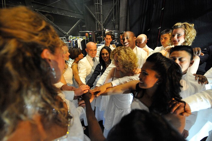 Tops in Blue members get together prior to show time at the North Charleston Performing Arts Center in North Charleston Nov. 8. Since its first world tour in 1953, Tops in Blue has performed on film, produced albums and appeared on national television with legends Ed Sullivan, Bob Hope and many others. (U.S. Air Force photo/James Bowman)