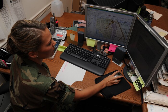 Airman 1st Class Nicole Reynolds prints a map for a customer in the 437th Civil Engineer Squadron Site Development Shop here Nov. 4. The maps are used by customers for referencing different base locations and by contractors performing various construction projects around the base. Airman Reynolds is an engineering assistant with the 437 CES Site Development Shop. (U.S. Air Force photo/Senior Airman Katie Gieratz)