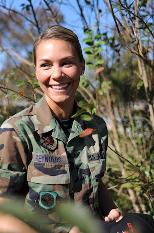 Airman 1st Class Nicole Reynolds takes a break during a site survey here Nov. 4. Depending on the type of survey, Airmen performing site surveys may work anywhere from a few hours, to several days on a project. Airman Reynolds is an engineering assistant with the 437th Civil Engineer Squadron Site Development Shop. (U.S. Air Force photo/Senior Airman Katie Gieratz)