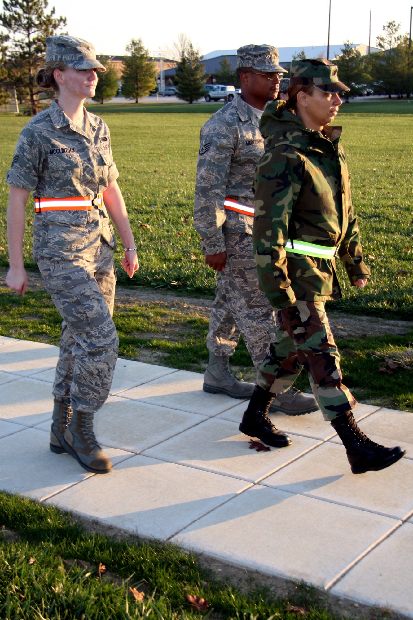 GRISSOM AIR RESERVE BASE, Ind., -- Tech. Sgt. Lachelle Marable, right, Staff Sgt. Gerald Merchant, center,  and Senior Airman Michaela McClintock, all from the 434th Logistics Readiness Squadron, march away after raising the flag on Nov. 7. Members of the 434th LRS conducted the flag honors for reveille that morning.  (U.S. Air Force photo/Staff Sgt. Mark Orders-Woempner)