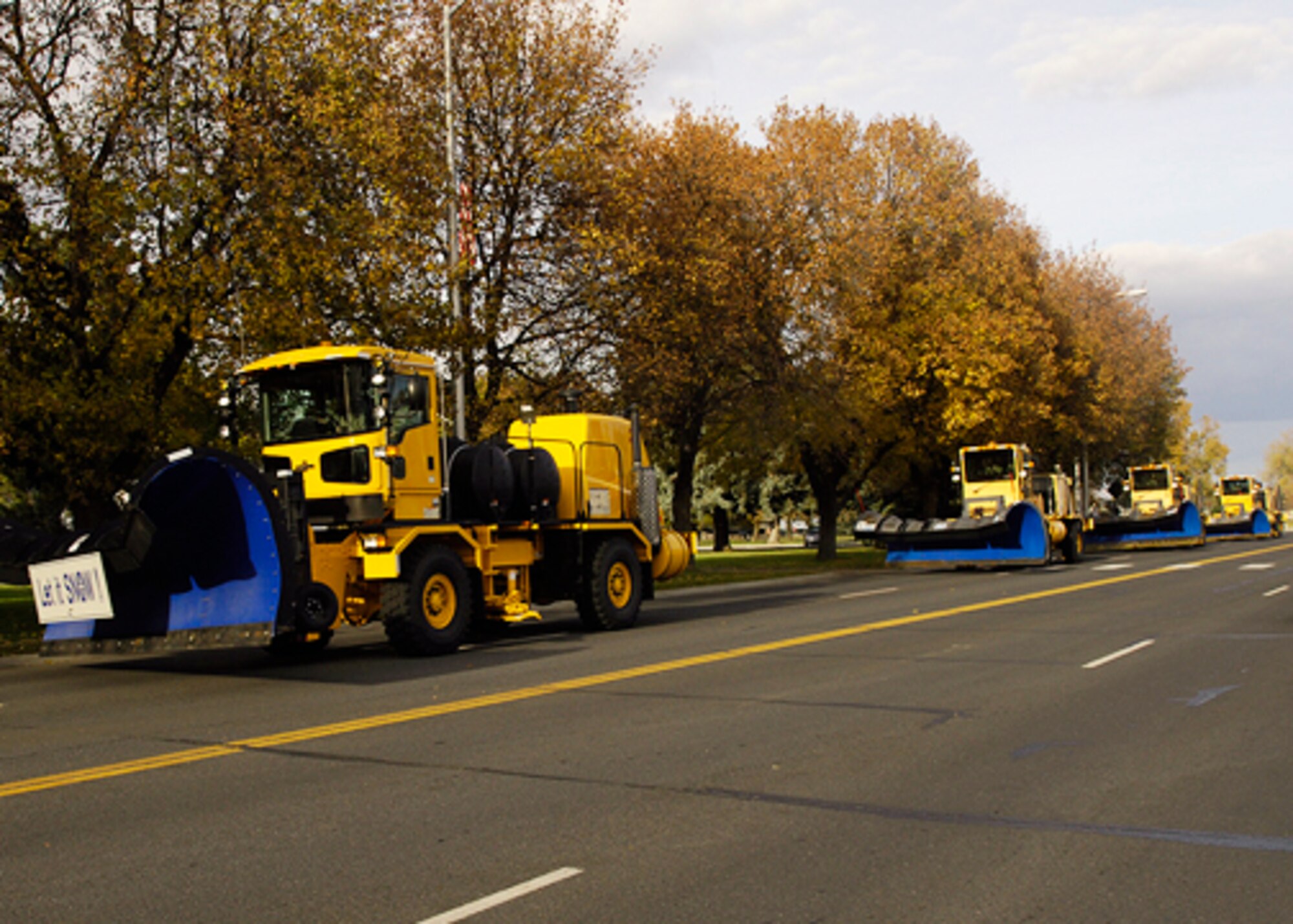 FAIRCHILD AIR FORCE BASE, Wash. ? Snow plows make a run past the 92nd Air Refueling Wing headquarters building during the annual snow parade here Oct. 28. (U.S. Air Force photo / Staff Sgt. Eunique Stevens) 
