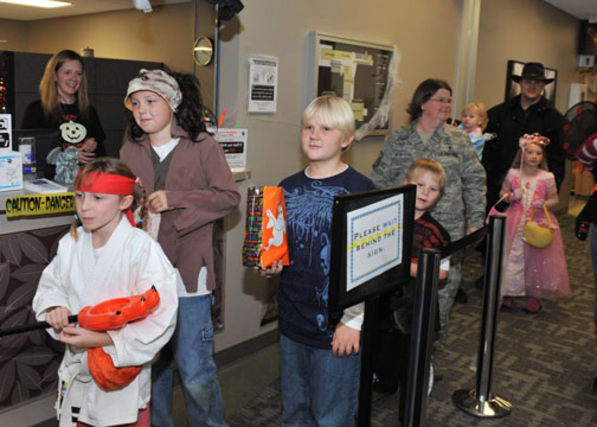 FAIRCHILD AIR FORCE BASE, Wash. ? Children receives candy at the base clinic during the Halloween party Oct. 28. This event is an annual event at Fairchild?s base clinic, which consisted of games, food, haunted house and candy that was distributed throughout the clinic from various offices. The personnel at the clinic wore customs all day to get in the spirit of Halloween. (U.S. Air Force photo / Staff Sgt. JT May III)
