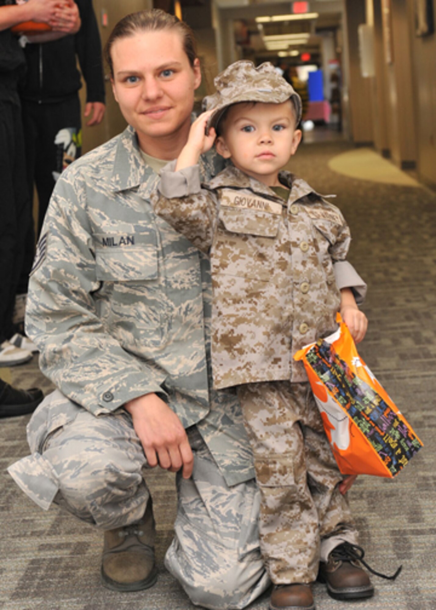 10/28/2009 - FAIRCHILD AIR FORCE BASE, Wash.  Staff Sgt. Lisa Milan, 92nd Medical Operations Squadron mental health, pose with her three year old son Giovanni Oct. 28. Giovanni was dressed in a Marine costume during the Halloween party at the base clinic. (U.S. Air Force photo / Staff Sgt. JT May III)