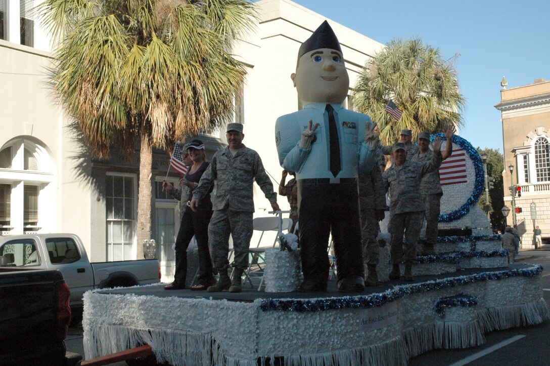 Members of the 315th Airlift Wing, Charleston AFB, S.C., ride on the 315th Veterans Day Parade float during the Charleston Annual Tri-County Veteran’s Day Parade.  This was the city’s 12th year hosting the Veterans Day Parade.  (Air Force photo/ SrA Dani Shea)