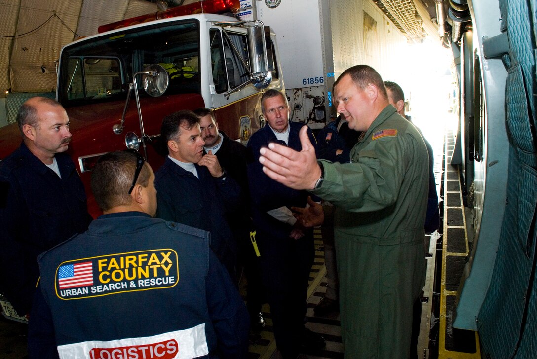 167th Airlift Wing loadmaster, Master Sgt Tim Nichols, explains aircraft loading procedures to members of Virginia Task Force 1  after loading a trailer full of their equipment into a C-5 Galaxy aircraft on Friday, November 6, 2009 at the Martinsburg, WestVirginia unit. Virginia Task Force 1's International Urban Serach and Rescue Team from the United States Agency for Interantional Development, based in Fairfax County, Va, utilized the West Virginia Air National Guard unit as a point of departure during a training exercise which simulated an overseas deployment. 
(U.S. Air Force photo by Master Sgt Emily Beightol-Deyerle)