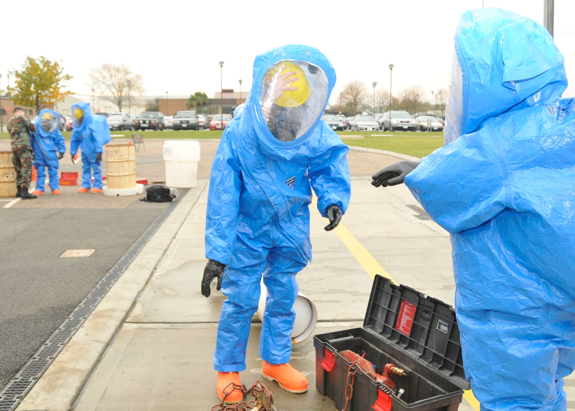 Master Sgt. Vincente Navejas and Airman 1st Class Matthew Kindoll, 48th Medical Group bioenvironmental technicians, get suited up before beginning the final practical evaluation to earn a hazardous material technician certification at RAF Lakenheath, England, Oct 30. The training consists of three hazardous scenarios.  (U.S. Air Force photo/Airman 1st Class Eboni Knox)