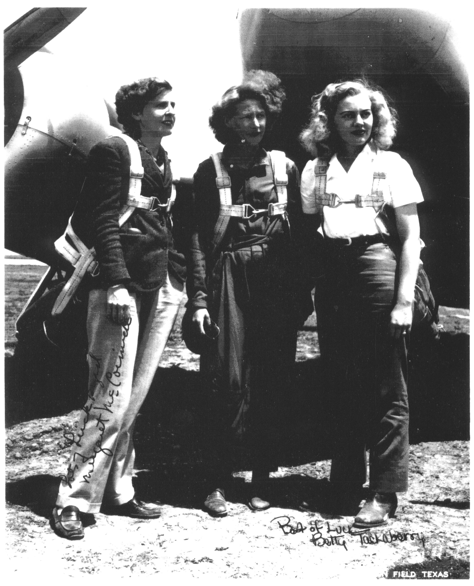 Betty Blake, right, and two friends pose for photographs as they don parachutes in 1943. (courtesy photo)