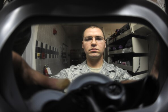 MINOT AIR FORCE BASE, N.D. --  Senior Airman Jimmy VanHuss, 5th Medical Group bioenvironmental engineering flight technician, performs a gas mask fit test at the 5th MDG Nov. 12. The bioenvironmental flight received an excellent rating in a recent health services inspection.  In all, the 5th MDG was inspected in 16 areas covering four major categories and received an overall rating of excellent. (U.S. Air Force photo by Senior Airman Wesley Wright)