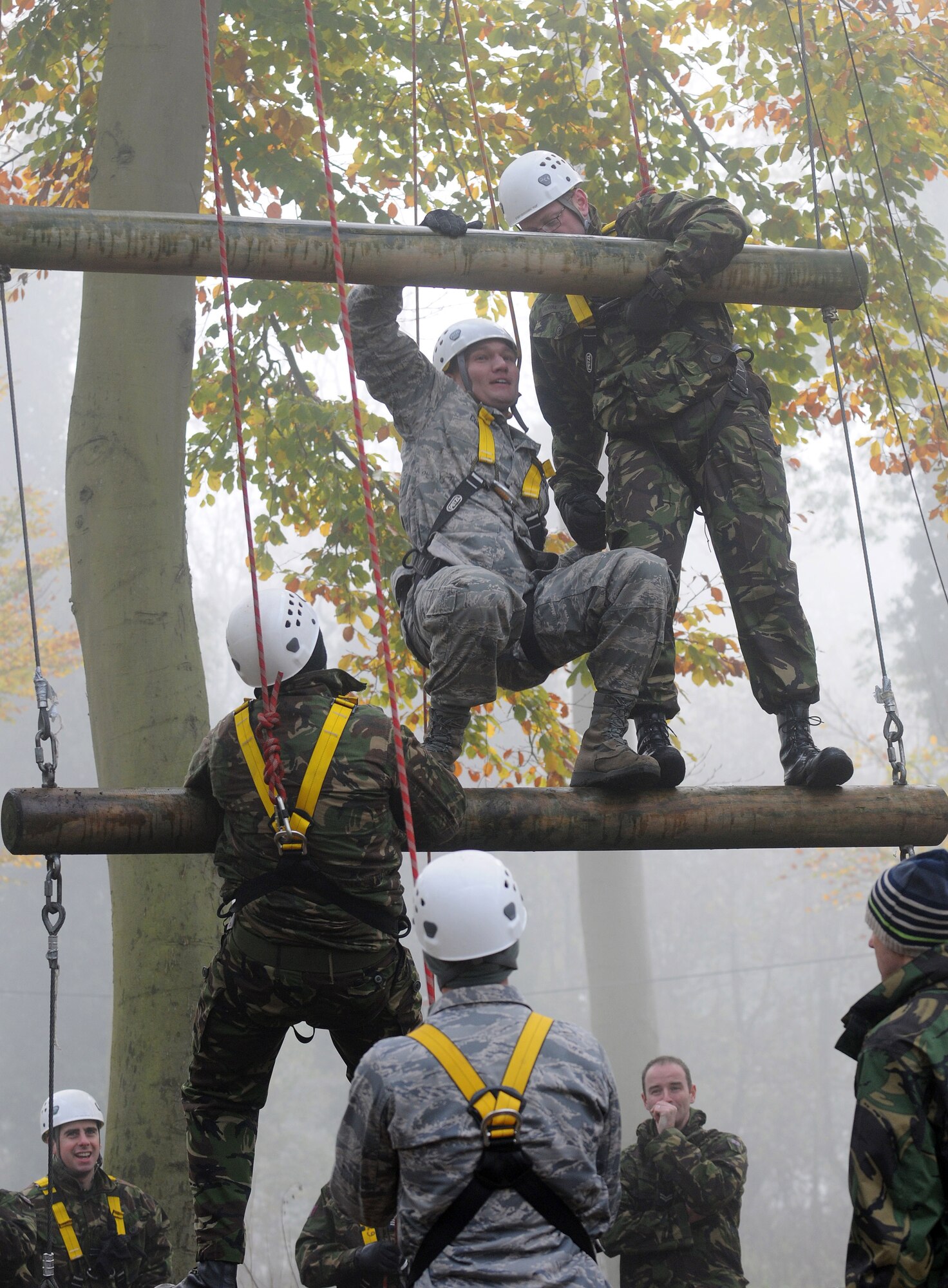 RAF MILDENHALL, England -- Master Sgt. Jason Conley, 48th Medical Support Squadron (second from top),  participates in the high-ropes course at RAF Marham with British airmen as part of the RAF's Leadership, Ethos and Air Power Day Nov. 9. Forty U.S. Airmen from RAFs Mildenhall and Lakenheath joined the exercise to build relationships and share leadership techniques. (U.S. Air Force photo/Senior Airman Thomas Trower) 