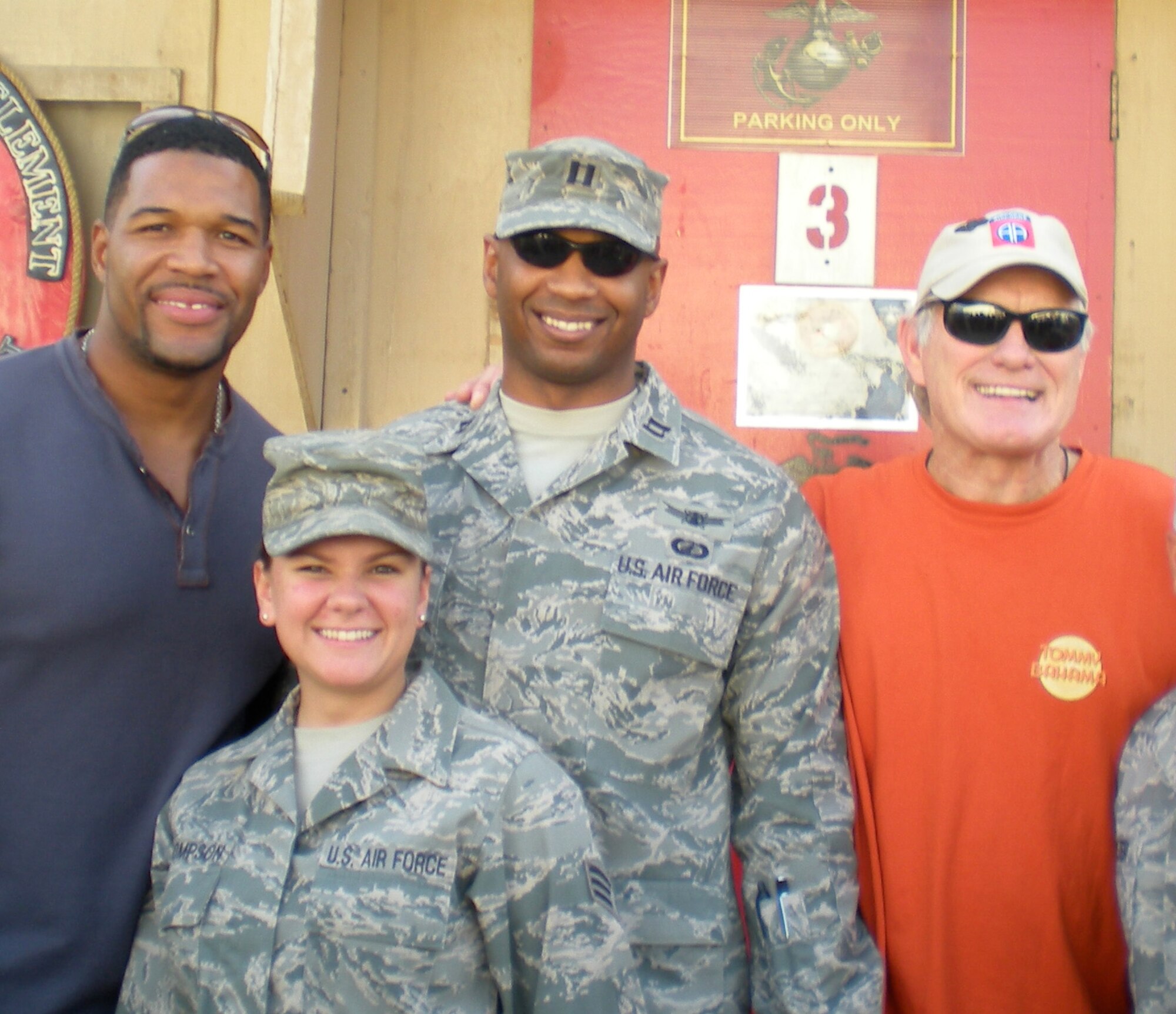 (Left to right) Michael Strahan, former New York Giants defensive end, Senior Airman Christian Thompson, 17th Force Support Squadron, Goodfellow AFB, Capt. Jacob Chisolm, Thompson’s supervisor and Terry Bradshaw, former Steelers quarterback pose for a photo in Bagram, Afghanistan, Nov. 8.  (U.S. Air Force Photo) 

