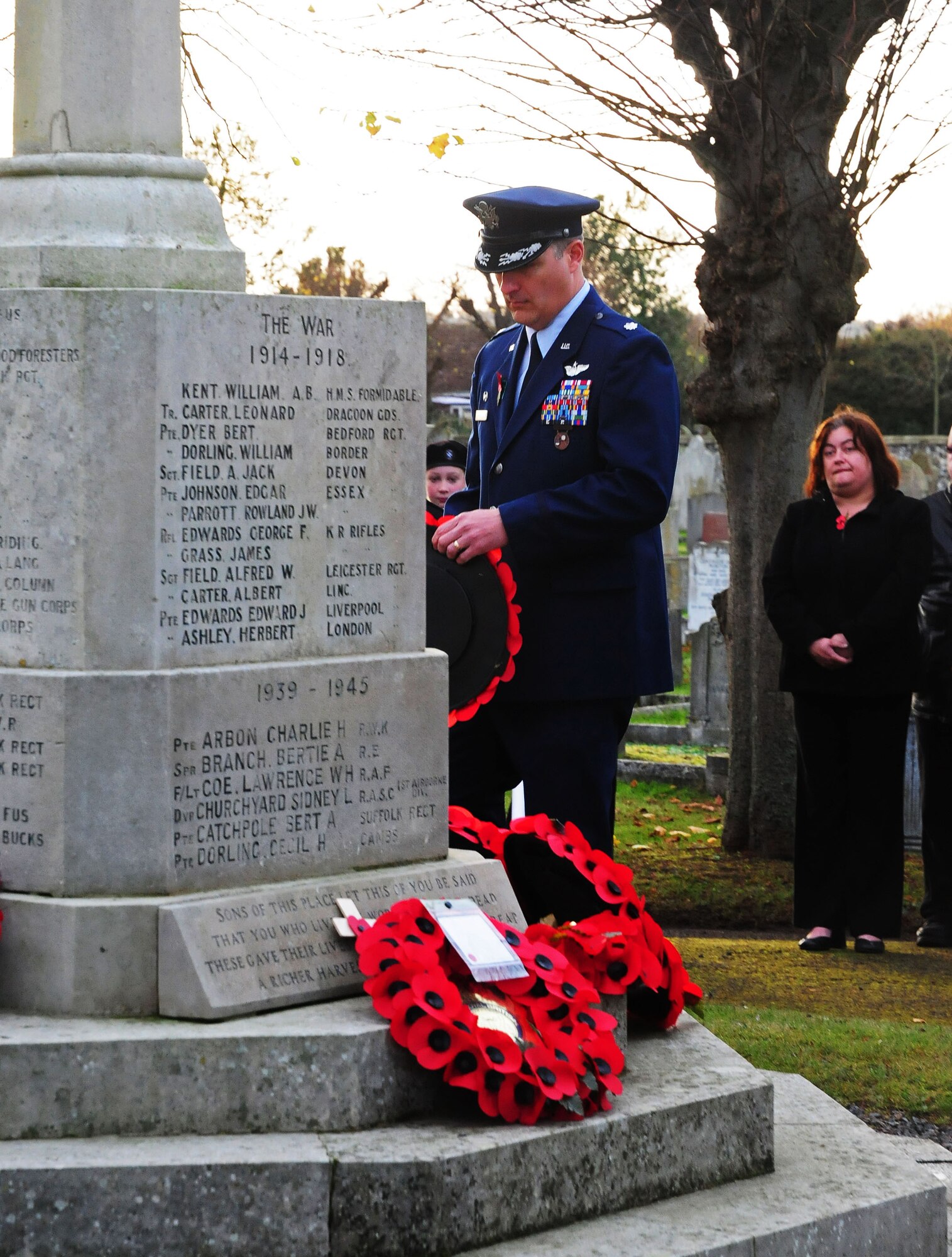 ROYAL AIR FORCE LAKENHEATH, England -- Lt. Col. Brent Vosseller, 48th Operations Support Squadron commander, participates in the British tradition of Remembrance Sunday at the war memorial cenotaph by laying down a poppy wreath in Brandon, England, Nov. 8.  Remembrance Sunday is observed the Sunday before Veterans Day and is a way to honor those who died or were injured in war by wearing red poppies and laying poppy wreaths at memorial sites.   (U.S. Air Force photo by Staff Sgt. Connor Estes)    