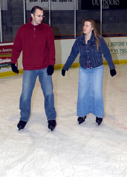 MINOT, N.D. -- 2nd Lt. David Tiller, 741st Missile Squadron deputy missile commander, helps his wife, Krista, as they each improve on their skating skills at the Maysa Arena Nov. 6 here. The two came to skate as one of the activities the Airman and Family Readiness Center put together for Air Force Family Week. The purpose of the week’s events is to focus collective attention of AF leadership on its families and recognize their service. (U.S. Air Force photo by Airman 1st Class Benjamin Stratton)