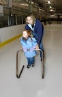 MINOT, N.D. -- Tech. Sgt. Lora Socia, 5th Munitions Squadron accountability assistant noncommissioned officer-in-charge, teaches her daughter, Lucy, how to skate at the Maysa Arena Nov. 6 here. The two came to skate as one of the activities the Airman and Family Readiness Center put together for Air Force Family Week. The purpose of the week’s events is to focus collective attention of AF leadership on its families and recognize their service. (U.S. Air Force photo by Airman 1st Class Benjamin Stratton)