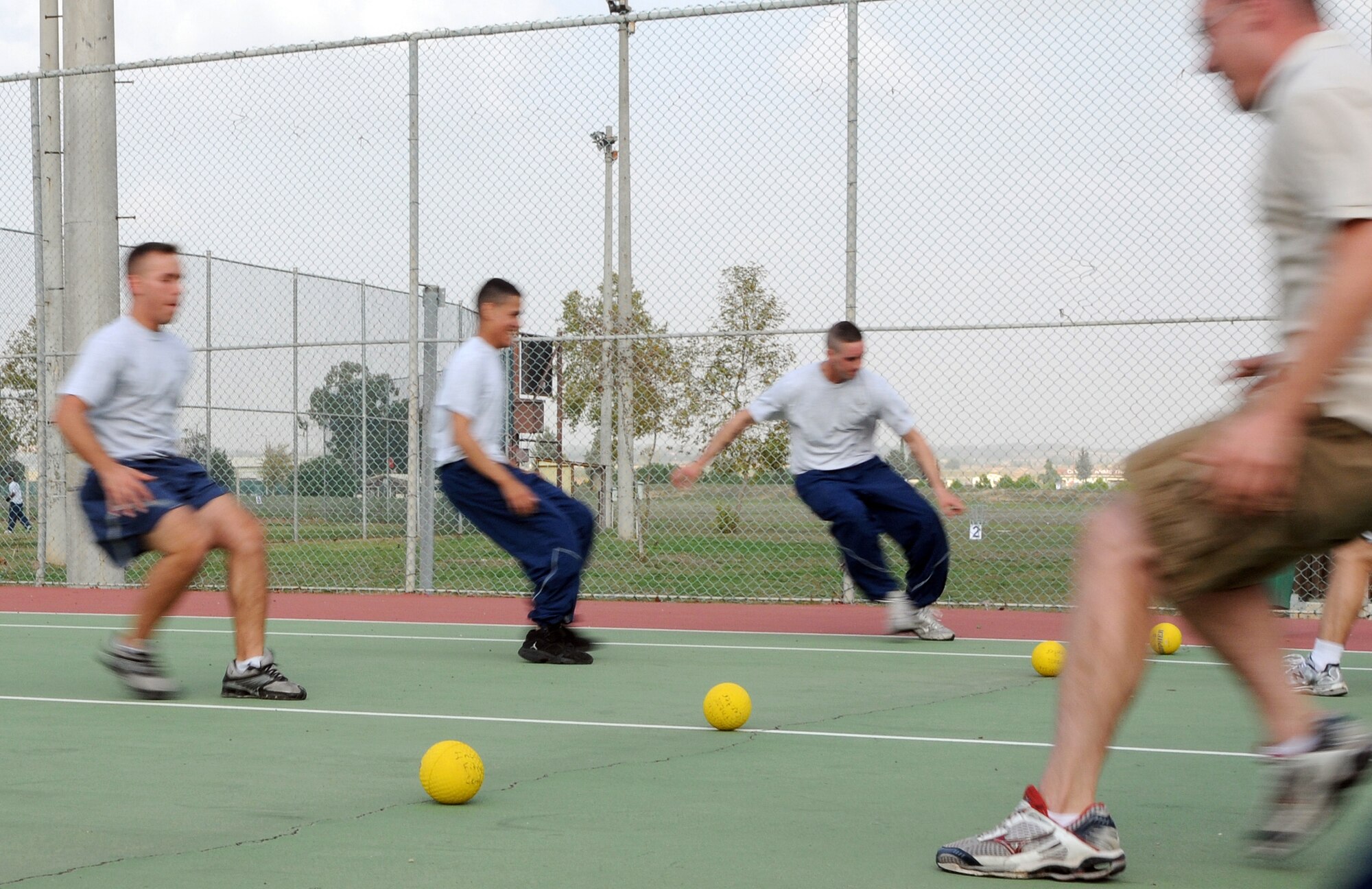 Airmen from the 39th Contracting Squadron and 39th Security Forces Squadron compete in a game of dodge ball on Wing Sports Day at Incirlik’s Arkadas Park, Monday, Nov. 9, 2009.  Units from the across the wing participated in the team-building event.  The 39th Security Forces Squadron won the dodge ball portion of the overall event.  They also gained the most points throughout the day, earning the squadron the Sports Day trophy which will be passed to different winners each year. (U.S. Air Force photo/Senior Airman Ashley Wood)