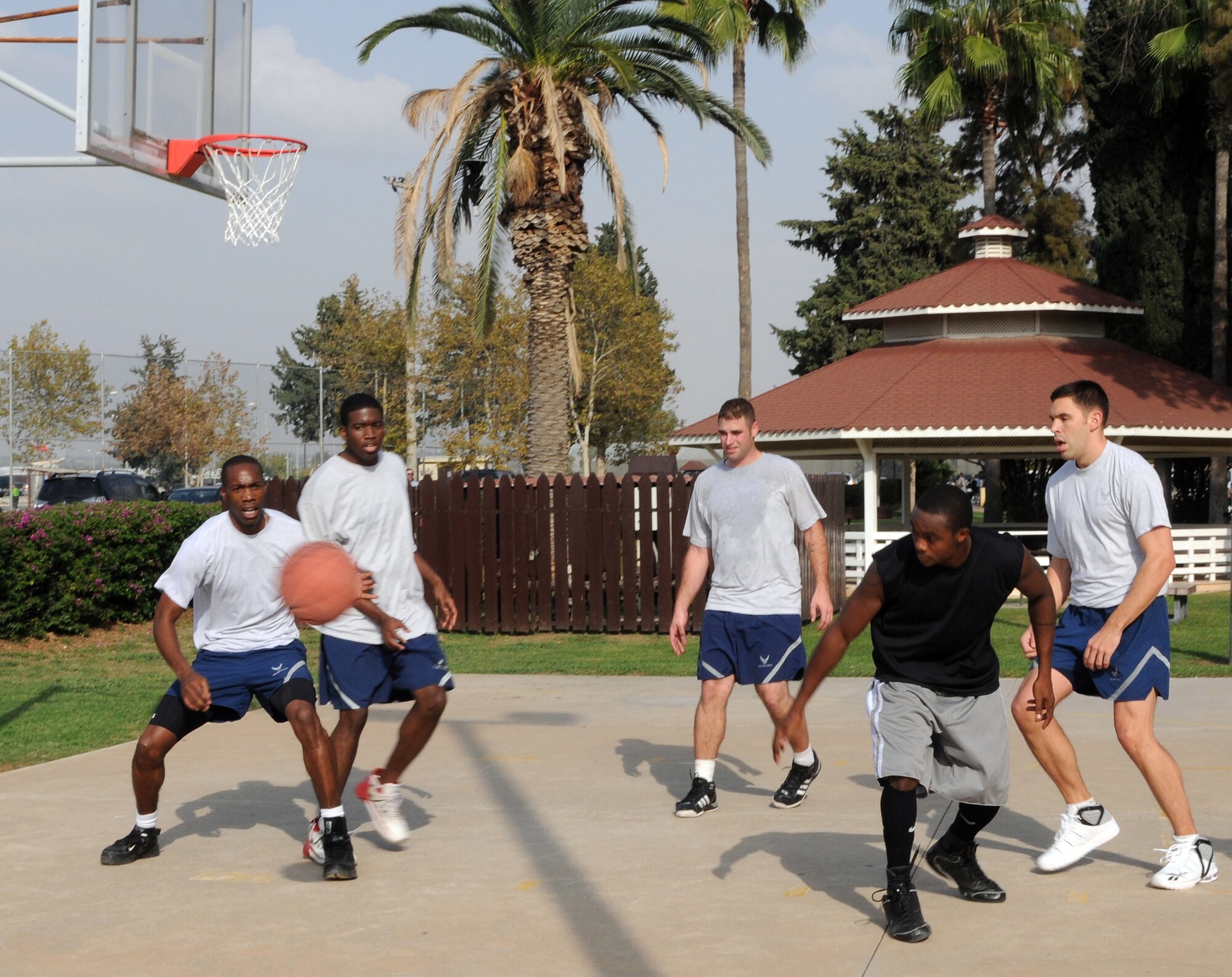 Airmen from the 39th Maintenance Squadron and 39th Comptroller Squadron compete in three-on-three basketball during Wing Sports Day, Monday, Nov. 9, 2009 at Incirlik’s Arkadas Park.   Units from across the wing participated in the team-building sports day.  The 39th Communications Squadron won the basket ball portion.   However, the 39th Security Forces Squadron gained the most points throughout the day, earning them the Sports Day trophy which will be passed to different winners each year. (U.S. Air Force photo/Senior Airman Ashley Wood)  