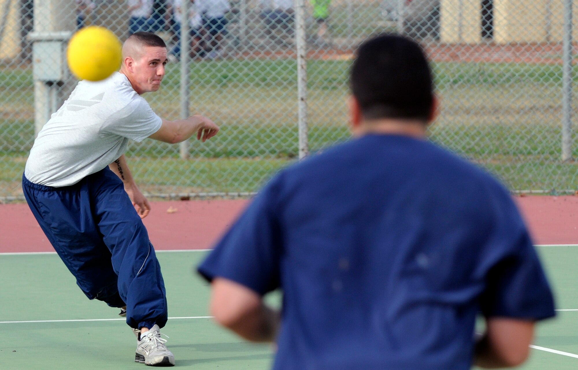 Airman 1st Class Tyler Cupp, 39th Security Forces Squadron, tries to take out a member of the 39th Contracting Squadron Monday, Nov. 9, 2009 during the 39th Air Base Wing Sports Day dodgeball tournament at Incirlik’s Arkadas Park.  Units from across the wing participated in the team-building event.  The 39th SFS won the dodgeball portion of the overall event.  The squadron members also gained the most points throughout the day, earning the squadron the Sports Day trophy which will be passed to different winners each year. (U.S. Air Force photo/Staff Sgt. Raymond Hoy)
