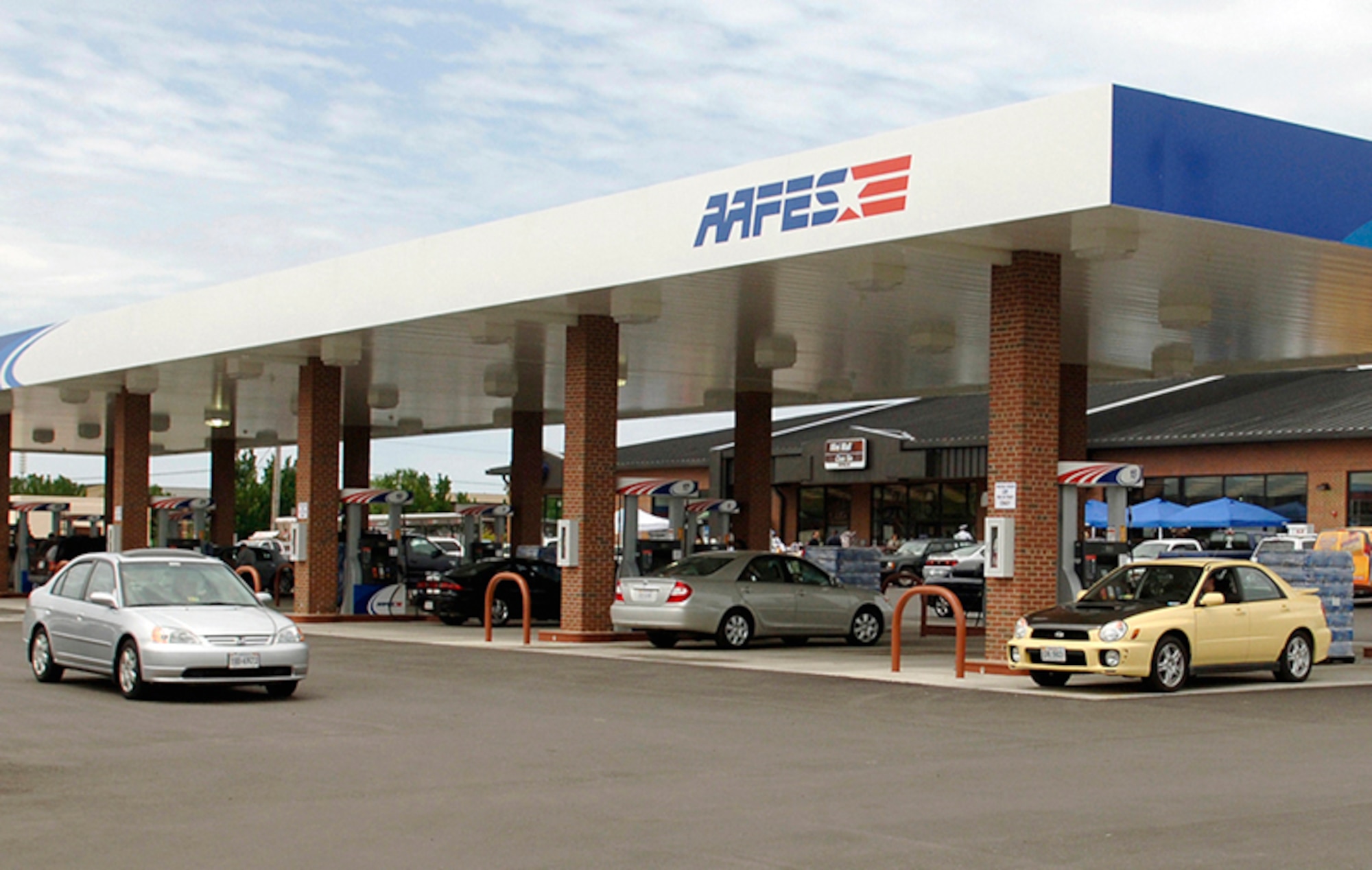 AAFES Gas Station - Customers line up to fill their tanks due to the discount AAFES offers on Veterans Day.  Military Shoppers will earn an additionl discount on all gasoline purchases when using their Military Star Card November 11th.