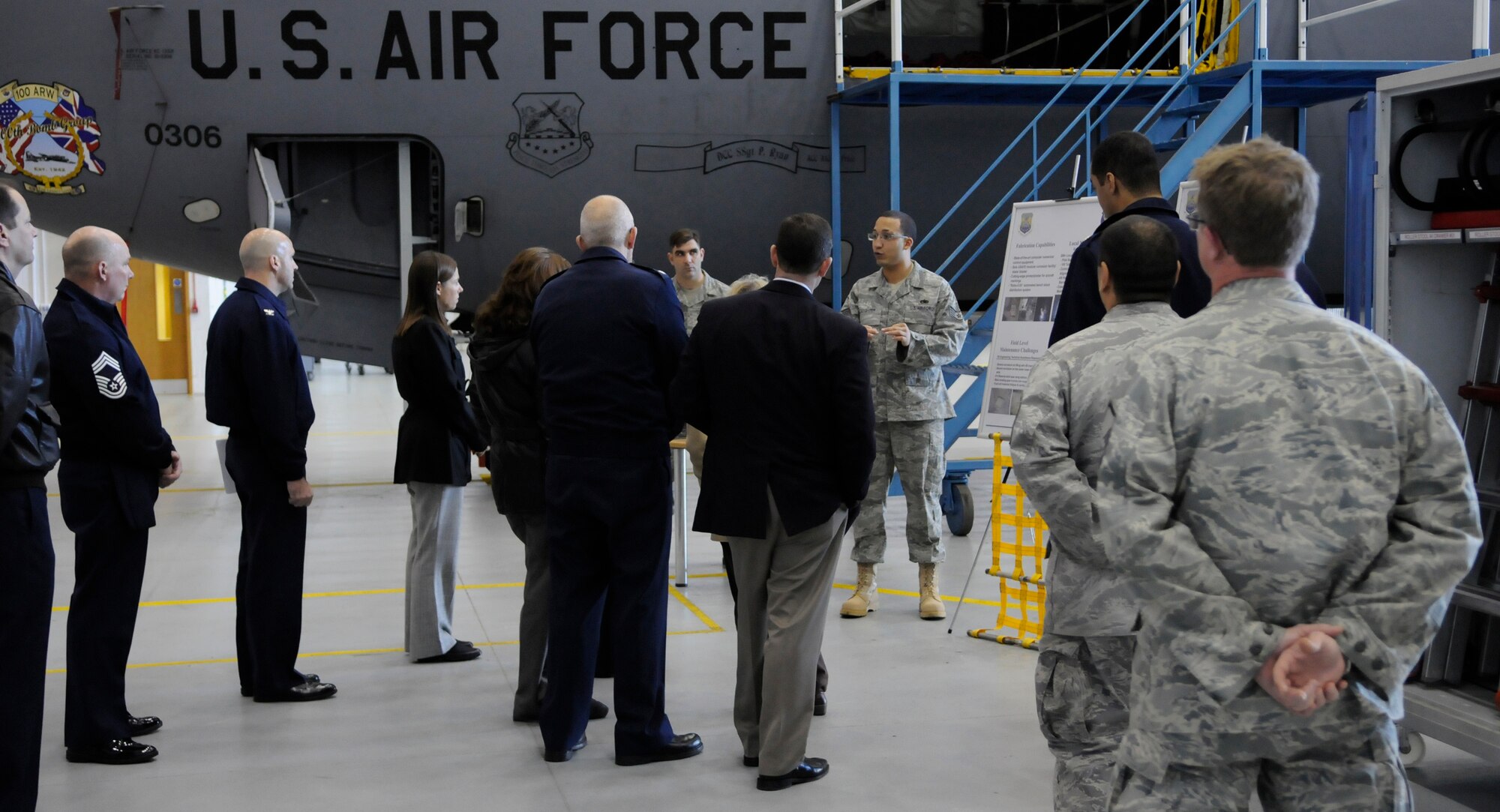 RAF MILDENHALL, England - Staff delegates from the House Armed Services Committee are briefed about aircraft corrosion during a tour of the base Nov. 9.  The corrosion briefing was one of many the delegates attended during their visit to RAFs Lakenheath and Mildenhall.  (U.S. Air Force Photo/Staff Sgt. Christopher L. Ingersoll)