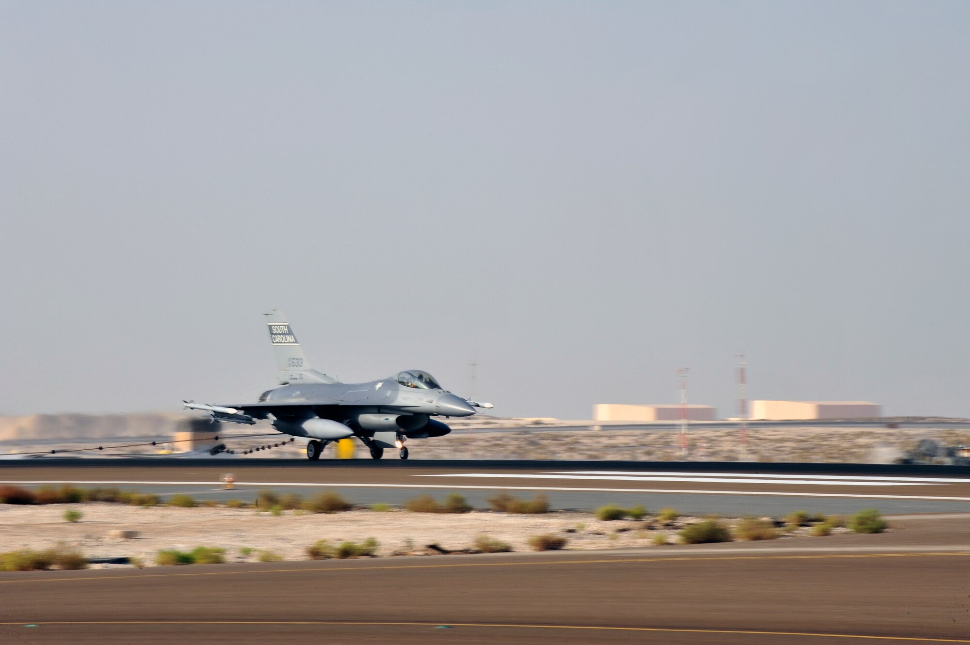 SOUTHWEST ASIA -An F-16 Fighting Falcon catches a mobile aircraft arresting system cable while taxiing the runway Nov. 8, 2009. The F-16 aircraft tested both directions on the runway before the annual MAAS certification was completed. (U.S. Air Force photo/Tech. Sgt. Charles Larkin Sr)