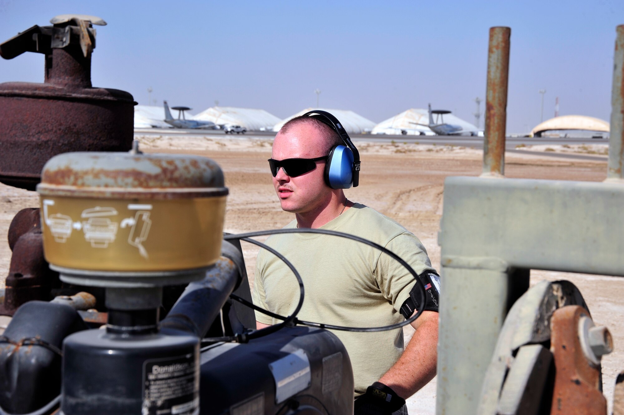 SOUTHWEST ASIA -Senior Airman Clinton Palmer, 380th Expeditionary Civil Engineer Squadron fire protection, monitors a mobile aircraft arresting system (MAAS) engine during an annual certification Nov. 8, 2009. Airman Palmer is deployed from Charleston Air Force Base, S.C., and grew up in Chatsworth, Ga. (U.S. Air Force photo/Tech. Sgt. Charles Larkin Sr)
