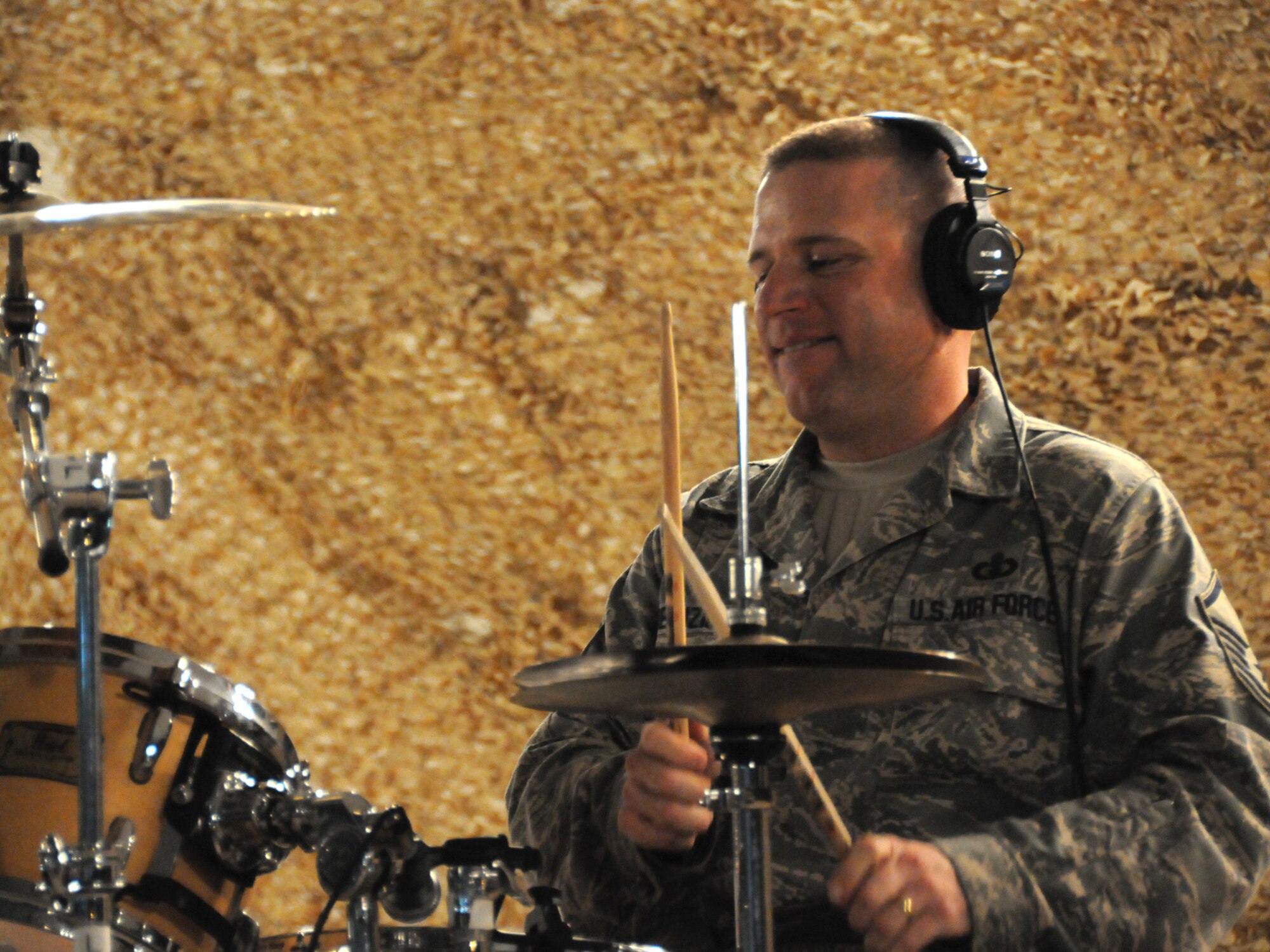 Master Sgt. Anthony DeLuzio, Air Forces Central Command band drummer, performs with the band Sirocco for an audience of deployed servicemembers at an undisclosed location in Southwest Asia, Nov. 7, 2009. Sirocco is deployed from Lackland Air Force Base, Texas in support of operations Iraqi Freedom and Enduring Freedom. (U.S. Air Force Photo/Tech. Sgt. Jason W. Edwards)