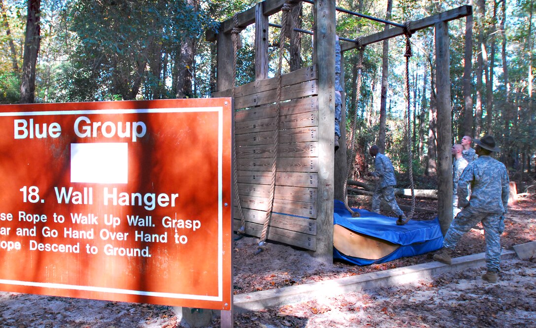 U.S. Army Sgt. 1st Class Timothy Simmons observes infantry recruits as they take on the "wall hanger," one of 25 obstacles at the Sand Hill confidence course on Fort Benning, Ga., Nov. 3, 2009. Simmons is a senior drill sergeant assigned to Company B, 1st Battalion, 19th Infantry Regiment, 198th Infantry Brigade.