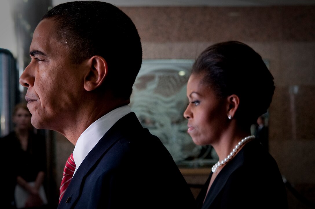 President Barack Obama and First Lady Michelle Obama prepare to take part  in a Nov. 10, 2009, ceremony on Fort Hood, Texas, to honor the victims of the Nov. 5 shooting rampage that left 13 dead and 38 wounded.