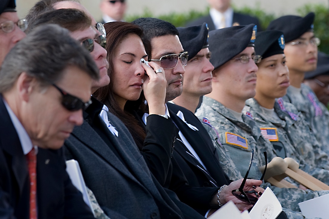 Family members and troops attend the Nov. 10, 2009, memorial service on Fort Hood, Texas, honoring the victims of the Nov.  5 shooting spree that left 13 dead and 38 wounded.