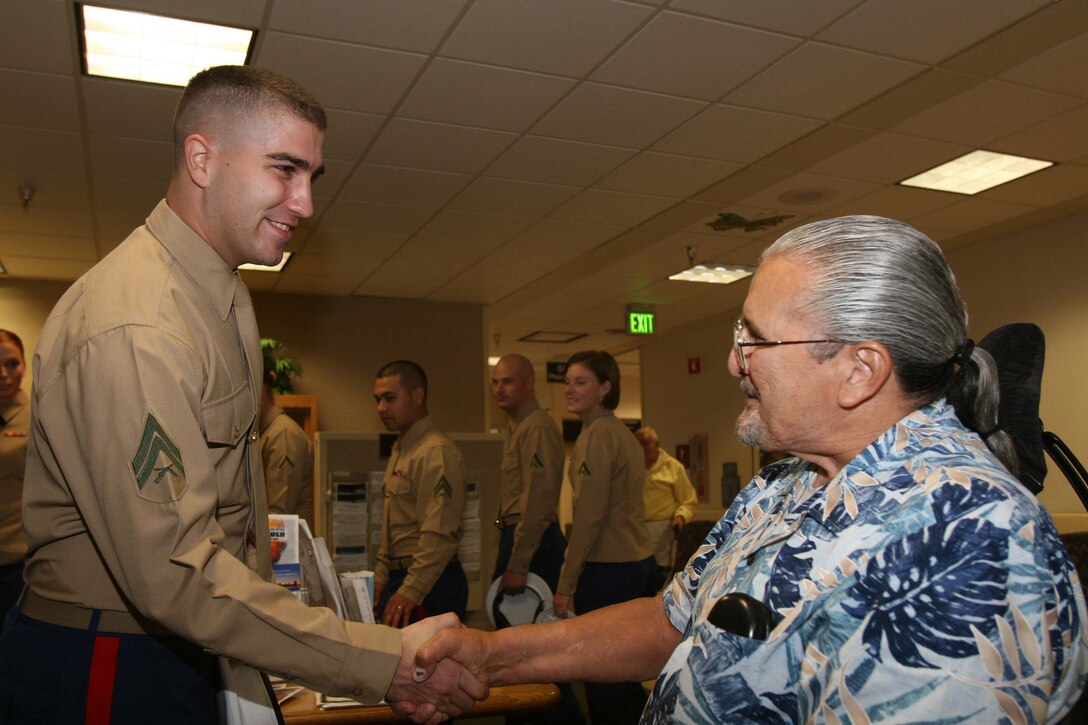 Ronald Costa, U.S. Navy retired, met Cpl Joshua Paul, an installation personnel administration center clerk at the Veterans Affairs hospital Nov. 10. Twenty Marines and sailors from Marine Corps Air Station Miramar met with patients at the Veterans Affairs Hospital to celebrate Veterans Day and honor their service.