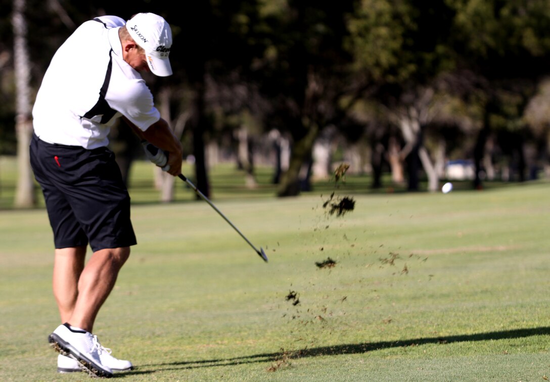Tyler Goulding, Air Force, strikes a golf ball with his 9-iron during a sudden death match to determine who will take 1st place in the individual portion of the 2009 Armed Services Golf Tournament at Camp Pendleton’s Marine Memorial Golf Course, Nov. 10.