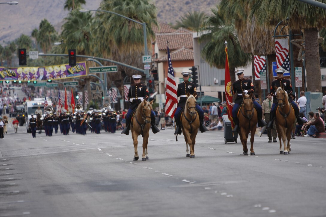 PALM SPRINGS, Calif. - Marine Corps Logistics Base Barstow's color guard Marines lead the way during the 13th annual Veteran's Day Parade Wednesday in downtown Palm Springs, Calif. Marines from 1st Tank Battalion and 3rd Light Armored Reconnaissance Battalion also provided tactical vehicles for the event.