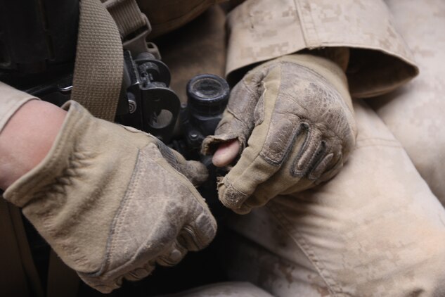 A Marine with Company G, 2nd Battalion, 7th Marine Regiment, rests after assaulting the Combat Center's Range 205 Nov. 11. The unit will deploy with the 31st Marine Expeditionary Unit in January, and this was the last training they will participate in prior to their deployment.