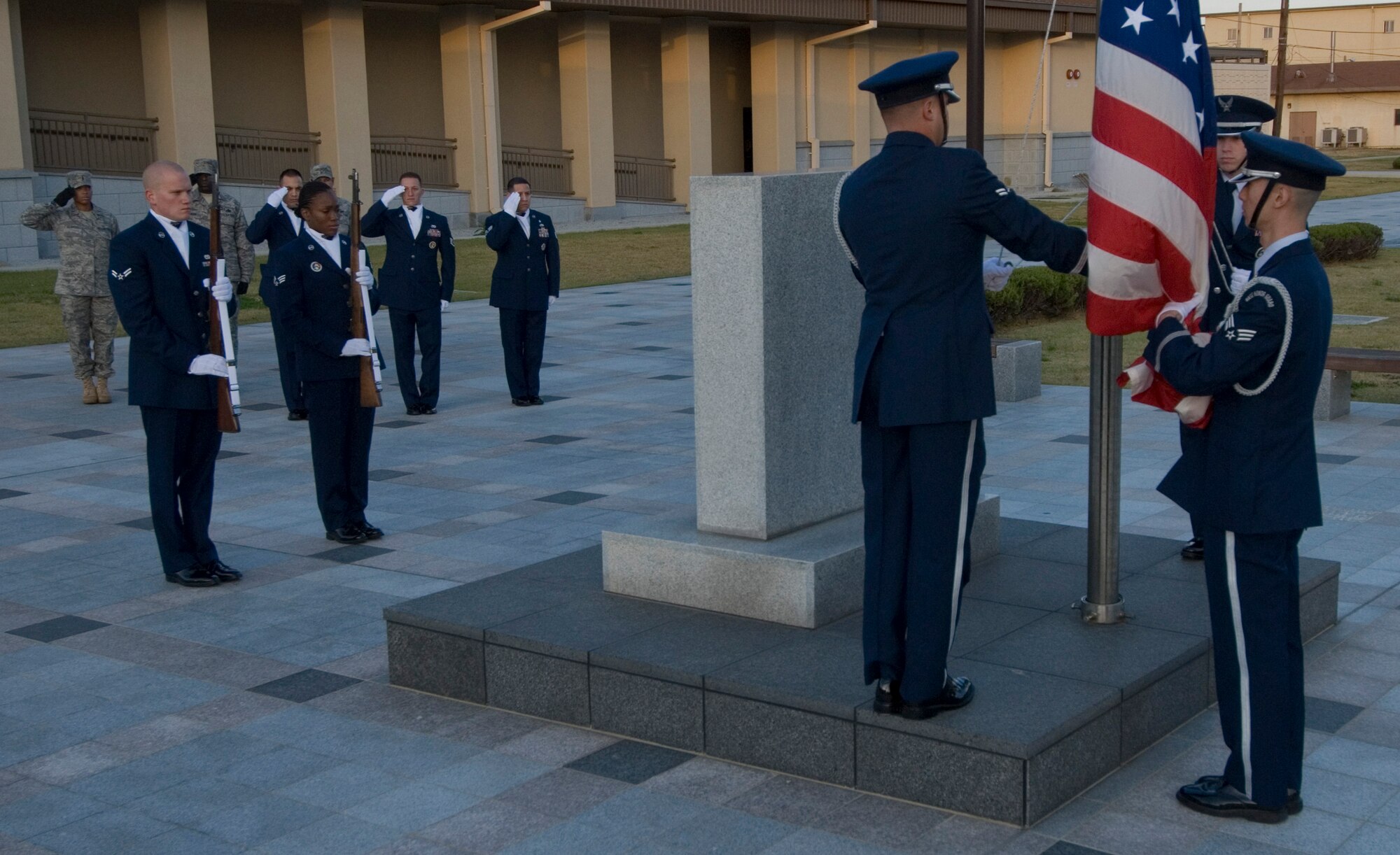 KUNSAN AIR BASE, Republic of Korea -- The Kunsan Air Base Honor Guard performs a retreat ceremony for Veterans Day, here Nov. 11. The Base Honor Guard held a Stand for Freedom fundraiser from reveille to retreat to raise funds for the Honor Guard. The funds will be used for incentive programs, trips and uniforms (U.S. Air Force photo/Senior Airman Roy Lynch)