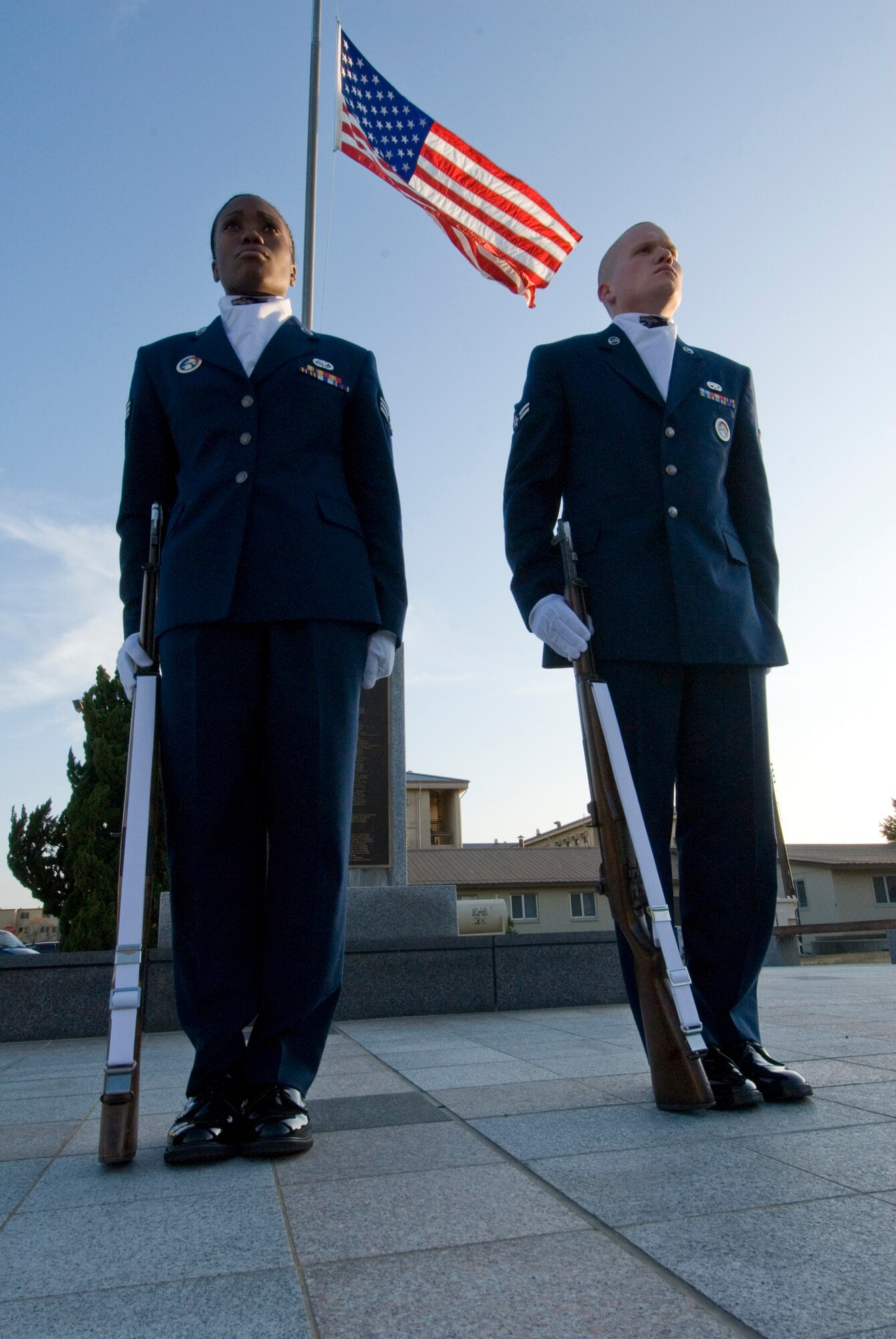 KUNSAN AIR BASE, Republic of Korea -- Senior Airman Danielle Todman, 8th Force Support Squadron, and Airman 1st Class Kyle Detwiler, 8th Maintenance Squadron, stand at attention for Stand for Freedom on Veterans Day, here Nov. 11. The event, which was held by the Kunsan Air Base Honor Guard, had two people standing at attention for 30 minutes at a time and lasted from reveille to retreat. The Honor Guard raised more than $1,900 to help with incentive programs, trips and uniforms. (U.S. Air Force photo/Senior Airman Roy Lynch)