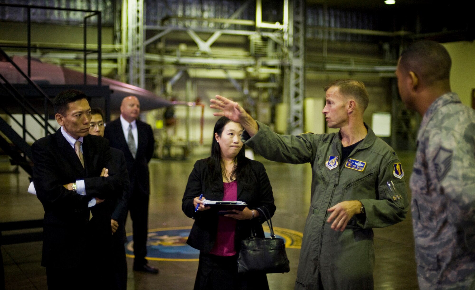 MISAWA AIR BASE, Japan -- Col. RC Craig, 35th Fighter Wing vice commander, explains weapon capabilities to Japan Ground Self-Defense Force Col. Yoshiki Kai Nov. 10 at Hangar 911. Colonel Kai is the JGSDF chief of information, communication and research, plans and operations department, ground staff office, Tokyo. (U.S. Air Force photo/Senior Airman Jamal D. Sutter)