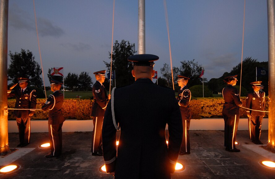 (Center) 1st Lt. Nicolas Schaeffer, 18th Munitions Squadron systems flight commander and Kadena honor guard assistant officer-in-charge, issues orders to his teammates as they prepare for a ceremony in early morning hours of Veteran's Day. The Kadena honor guard and approximately 200 servicemembers representing all military branches paid tribute to the Nov. 11 holiday honoring those who served in the military - both past and present. (Air Force/Staff Sgt. Jason Lake)