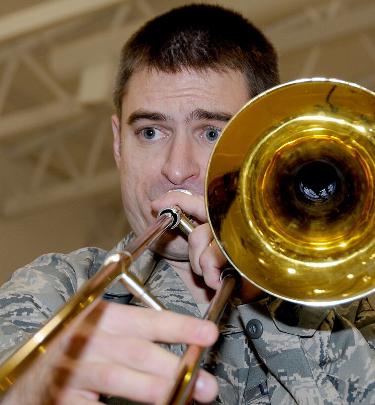 Staff Sgt. Jeff Dahlseng, a trombonist with the Northern Light Brass section of the U.S. Air Force Band of the Pacific, performs for St. George residents as part of Operation Santa Claus 2009. U.S. Air Force photo by 1st Lt. John Callahan.