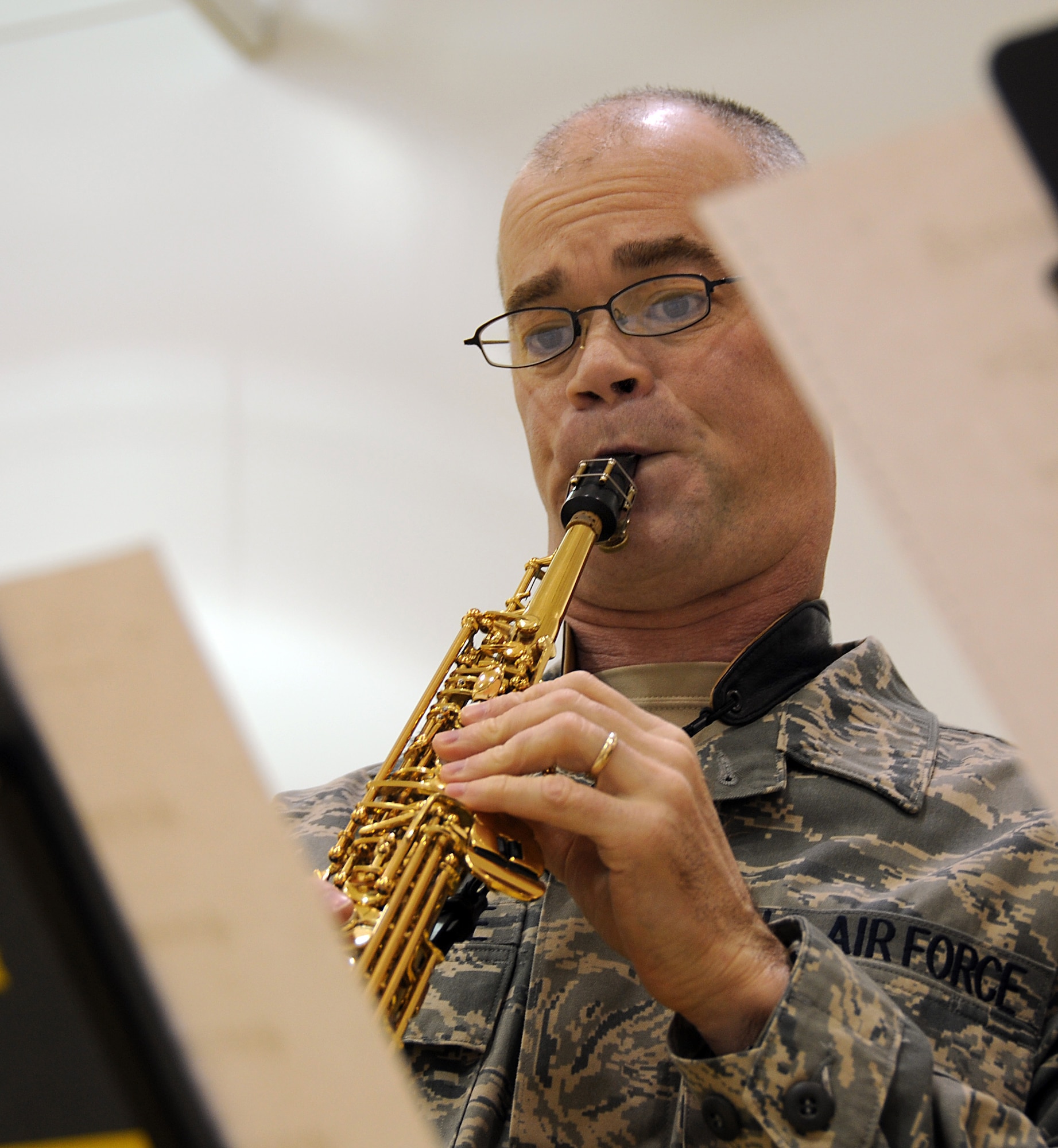 Tech. Sgt. Mike Van Arsdale, a member of the U.S. Air Force Band of the Pacific, plays a Christmas tune at St. George School on Nov. 7, 2009. U.S. Air Force photo by 1st Lt. John Callahan. 