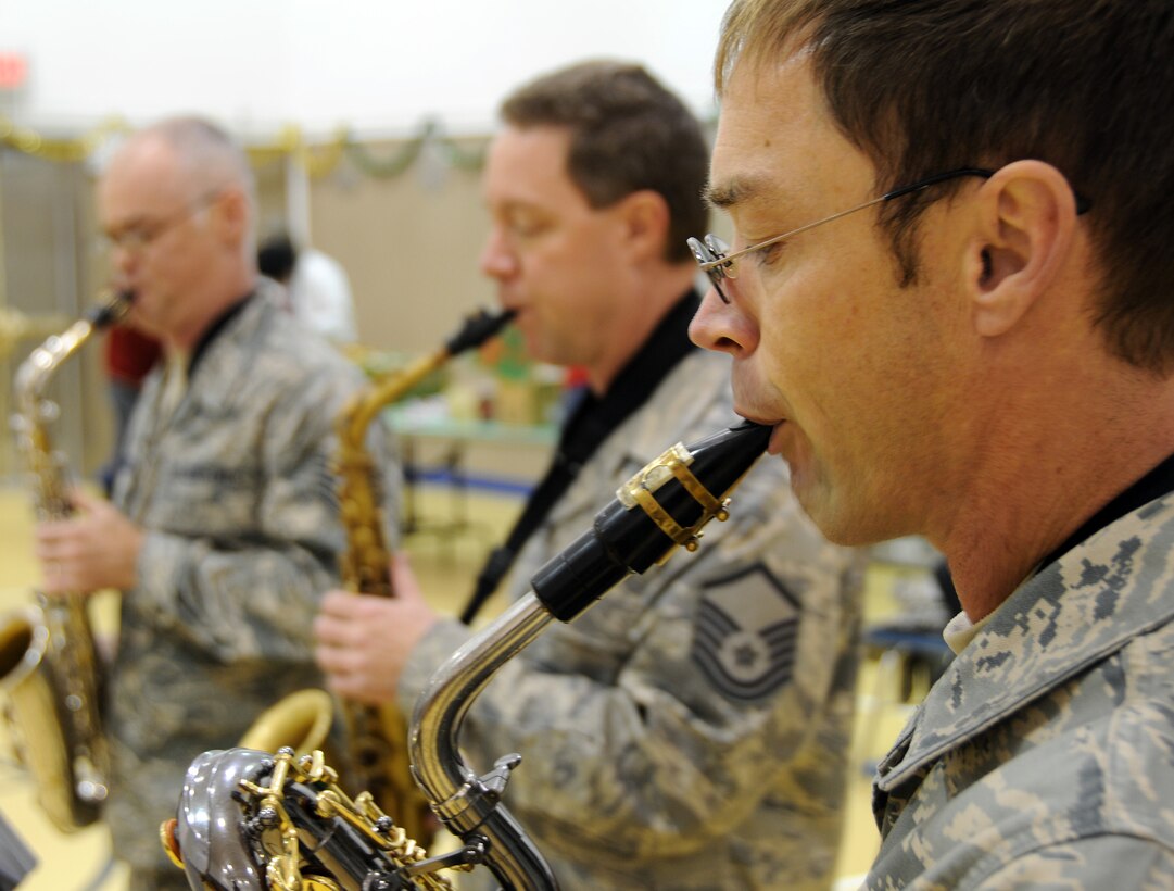 The Arctic Sax Quartet, part of the Air Force Band of the Pacific, performs at the St. George School on Nov. 7, 2009. In the foreground is Master Sgt. Brian Jenner on baritone sax; behind him are Tech. Sgt. Mike Van Arsdale (left) on tenor sax, and Master Sgt. Lon Throop on alto sax. U.S. Air Force photo by 1st Lt. John Callahan.