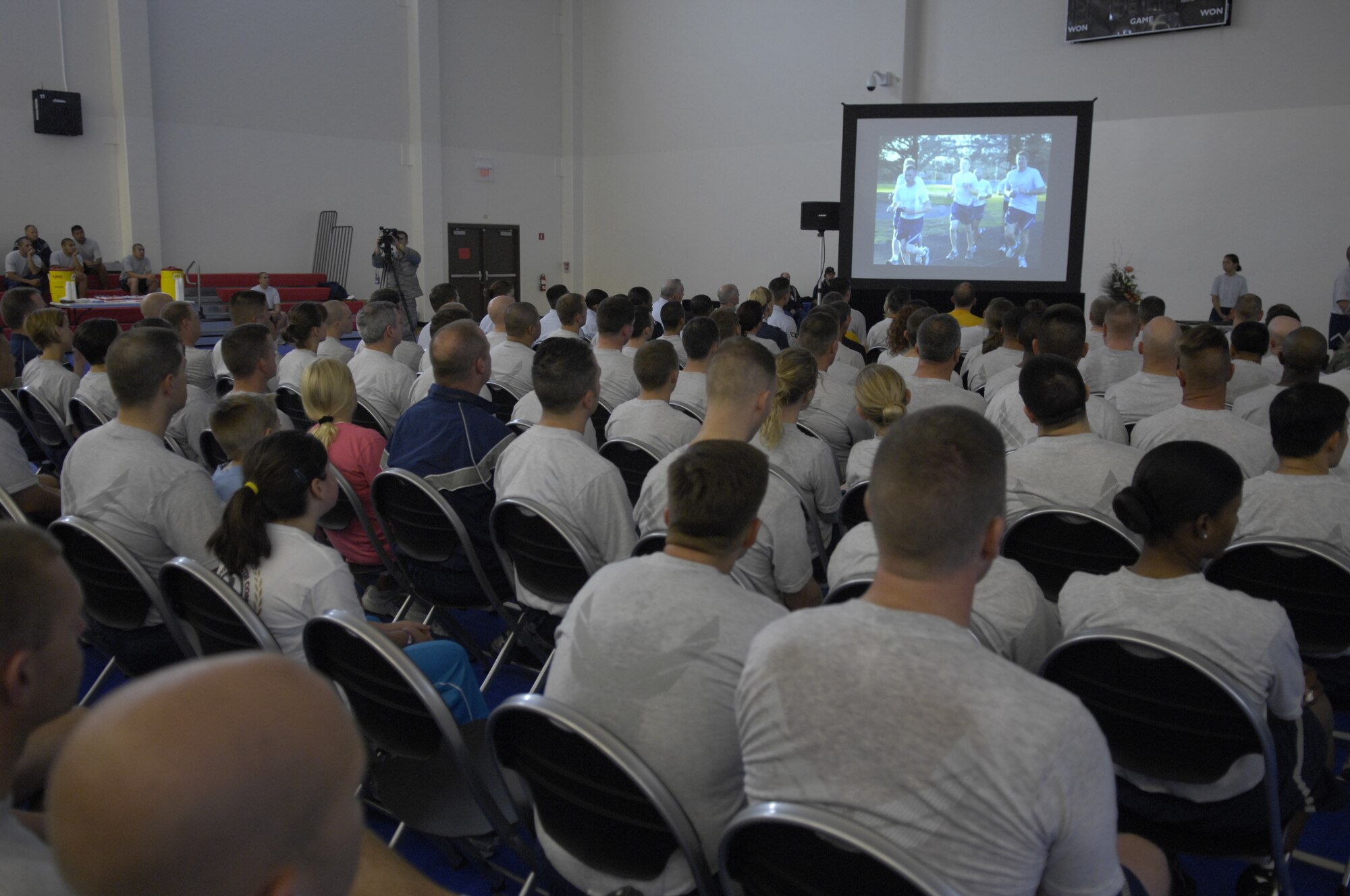 VANDENBERG AIR FORCE BASE, Calif. -- Members of Team Vandenberg watch a slideshow that covers the last 3 weeks of the Run to Remember here Wednesday, Nov. 11, 2009. Held over the last three weeks, The Run to Remember, raised over $4000, involved military members running over 7000 miles to honor the over 5000 fallen American servicemembers during Operations Iraqi and Enduring Freedom. (U.S. Air Force photo/Staff Sgt. Levi Riendeau)